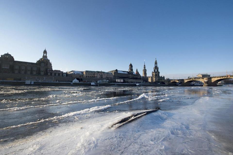 Ice floes float on Elbe river in Dresden, eastern Germany, Wednesday Jan. 11, 2017. More heavy snow in Eastern Europe is causing fresh hazards for people already struggling with travel delays, power outages and sub-zero temperatures. Two more deaths were reported in Poland, the worst-hit nation in the recent cold snap to sweep Europe, which has now caused at least 65 deaths. (Arno Burgi/dpa via AP)