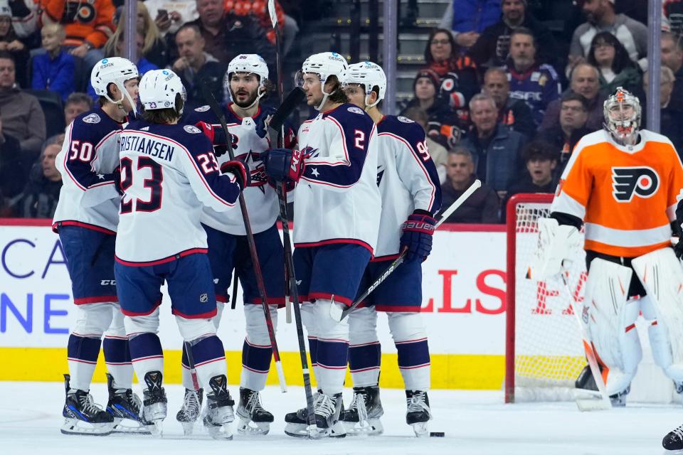 Columbus Blue Jackets' Kirill Marchenko (86) celebrates with teammates after scoring a goal during the second period of an NHL hockey game against the Philadelphia Flyers, Tuesday, Dec. 20, 2022, in Philadelphia. (AP Photo/Matt Slocum)