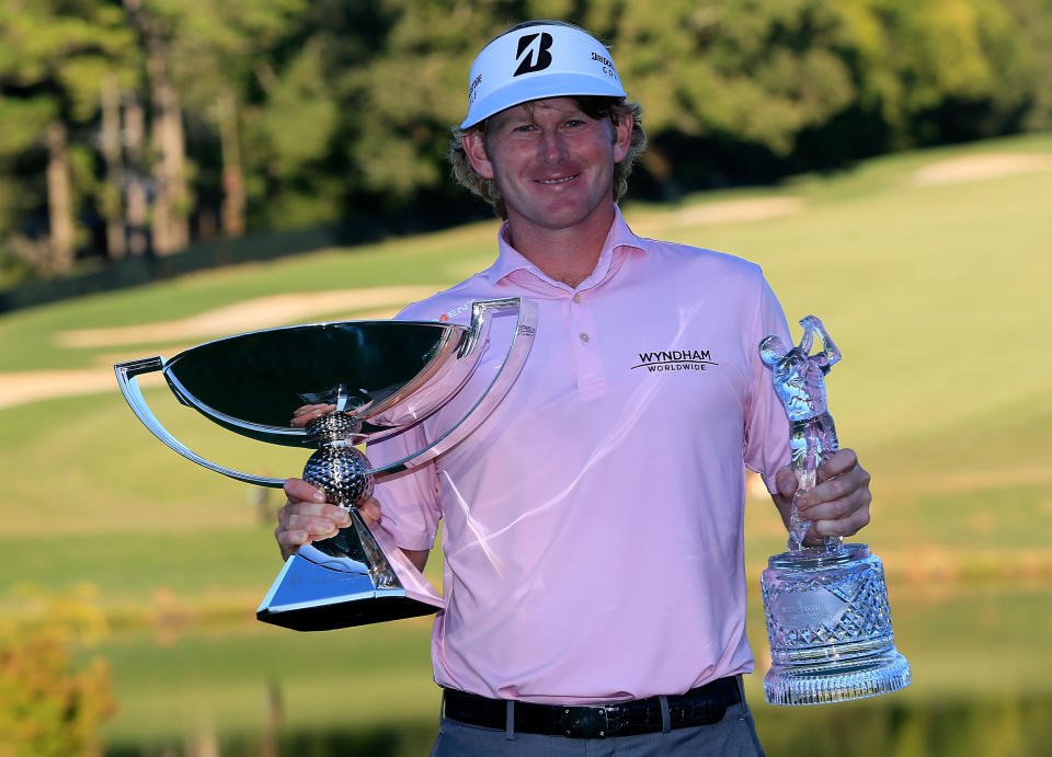 ATLANTA, GA - SEPTEMBER 23: Brandt Snedeker poses with the FedExCup and TOUR Championship trophies after his three stroke victory clinched the FedExCup during the final round of the TOUR Championship by Coca-Cola at East Lake Golf Club on September 23, 2012 in Atlanta, Georgia. (Photo by Sam Greenwood/Getty Images)