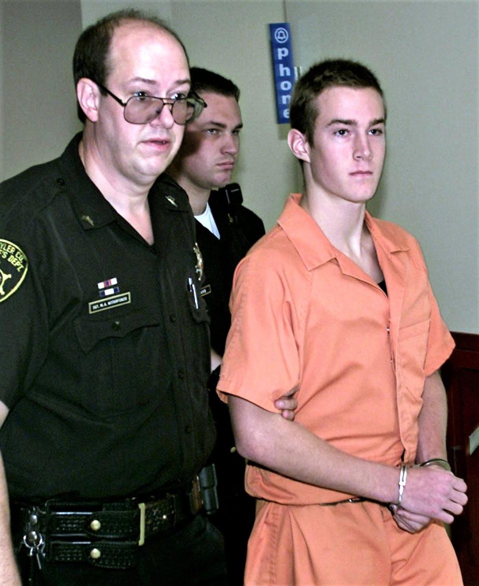 Schuyler County Sheriff's Office Sgt. MIchael Notarfonzo leads defendant Joshua Horein back to jail in August 2000 following Horein's arraignment on murder charges in Schuyler County Court.