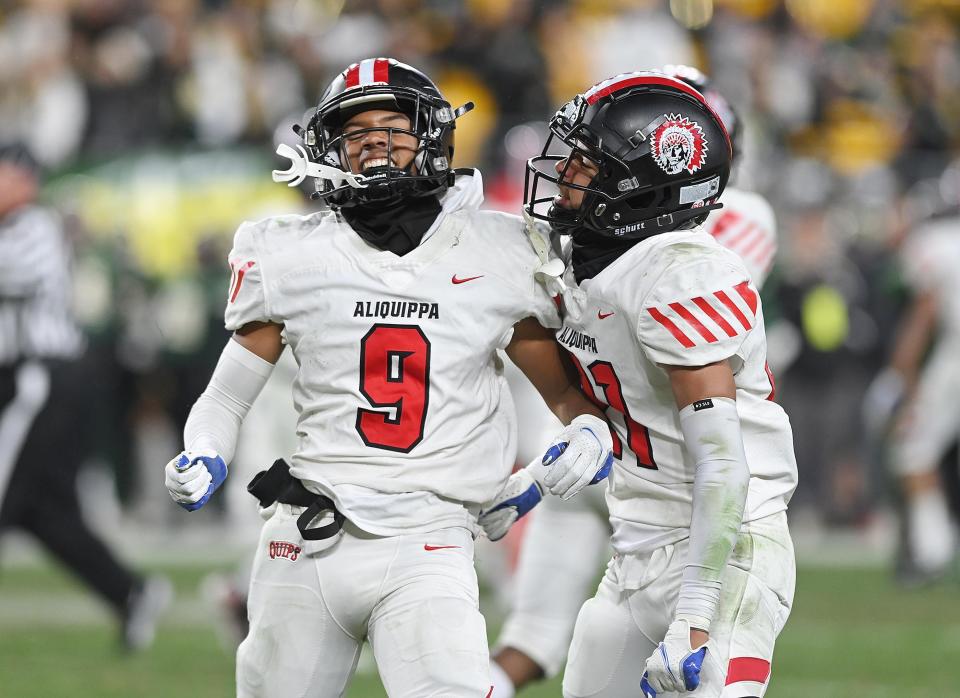 Aliquippa's Brandon Banks and Donovan Walker react after Banks intercepted the ball during Saturday's WPIAL Class 4A championship game against Belle Vernon at Heinz Field.