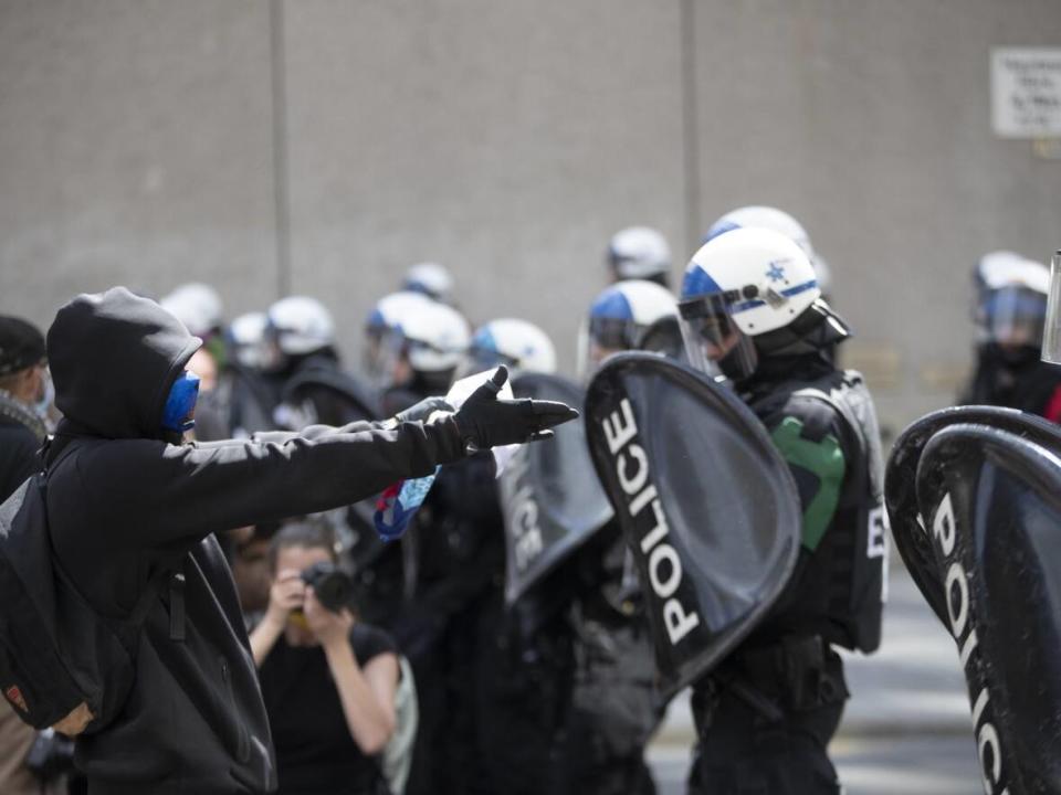 A protester comes face-to-face with Montreal police at an anti-racism demonstration downtown June 7, 2020. (Ivanoh Demers/Radio-Canada - image credit)