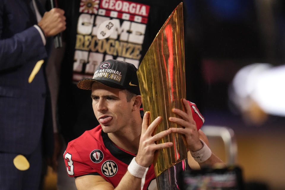 Georgia quarterback Stetson Bennett (13) celebrates after the national championship NCAA College Football Playoff game against TCU, Monday, Jan. 9, 2023, in Inglewood, Calif. Georgia won 65-7. (AP Photo/Ashley Landis)