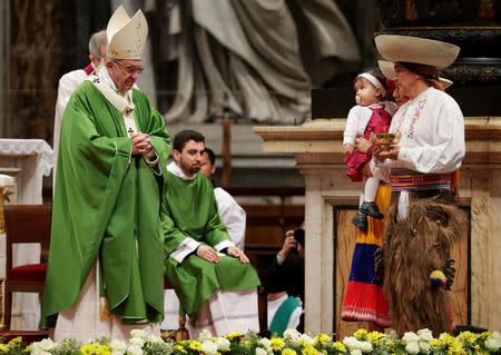 Pope Francis leads a special mass to mark International Migrants Day in Saint Peter's Basilica at the Vatican January 14, 2018. REUTERS/Max Rossi