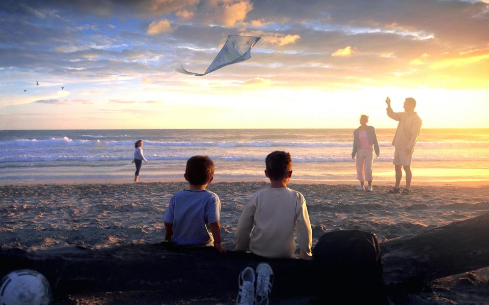 BEACH SUNSET - PETER CADE/GETTY