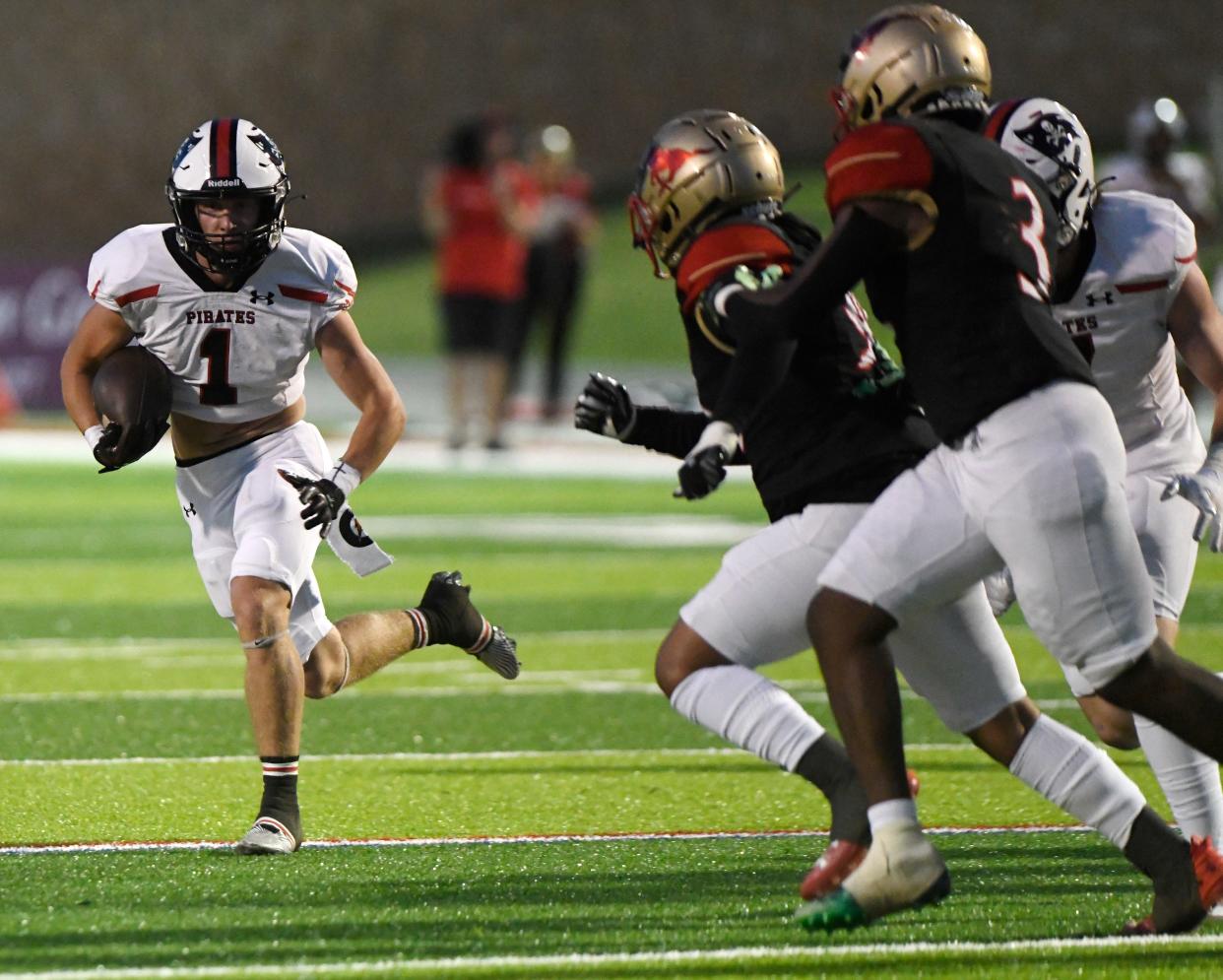 Lubbock-Cooper's Jackson Austin runs with the ball against Coronado in a District 2-5A Division I football game, Friday, Sept. 29, 2023, at Lowrey Field at PlainsCapital Park.