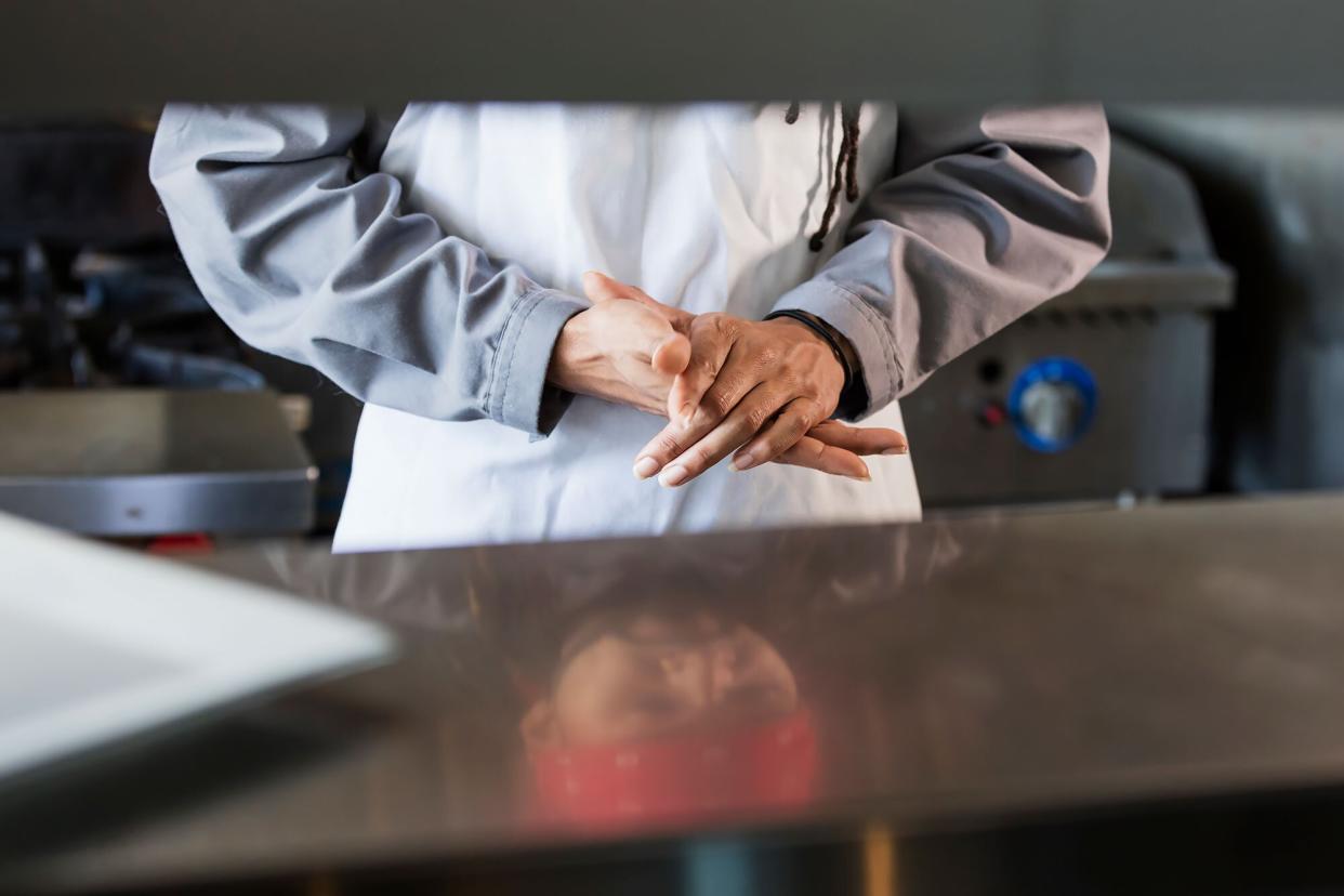 View of a mixed race chef in a restaurant kitchen