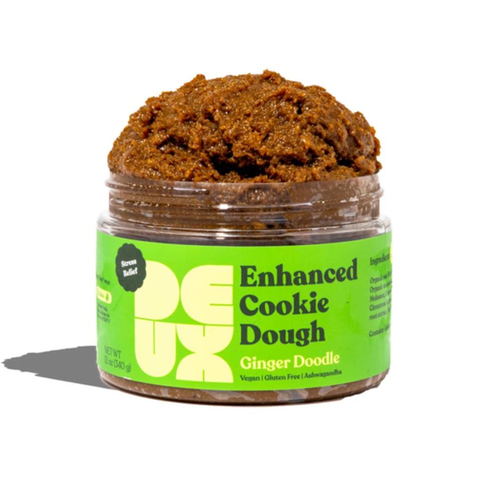 <p>This vegan and gluten-free <a href="https://www.eatdeux.com/collections/all-products/products/ginger-doodle" rel="nofollow noopener" target="_blank" data-ylk="slk:cookie dough;elm:context_link;itc:0;sec:content-canvas" class="link ">cookie dough</a> can be enjoyed from the jar or baked in the oven to cozy up. Each jar ginger-flavored dough is packed with ashwagandha and cinnamon. </p>