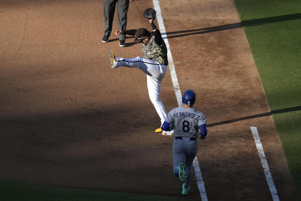 San Diego Padres first baseman Ji Man Choi makes the catch for the out on Los Angeles Dodgers' Kiké Hernandez (8) during the seventh inning of a baseball game Sunday, Aug. 6, 2023, in San Diego. (AP Photo/Gregory Bull)