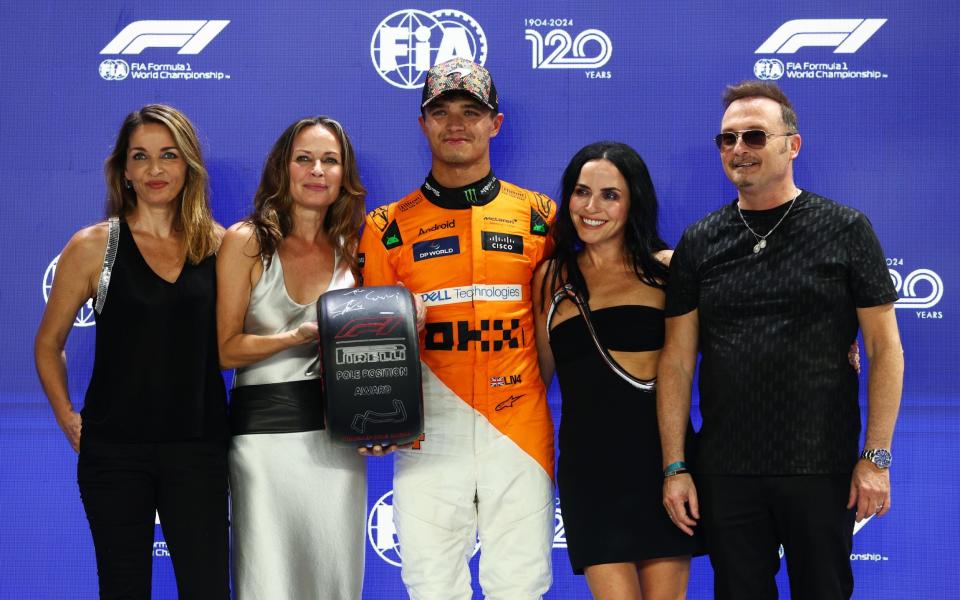 Music band The Corrs present Lando Norris with the pole position award