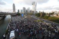 Israelis protestors block the Ayalon freeway in Tel Aviv during a demonstration called by members of the Ethiopian community