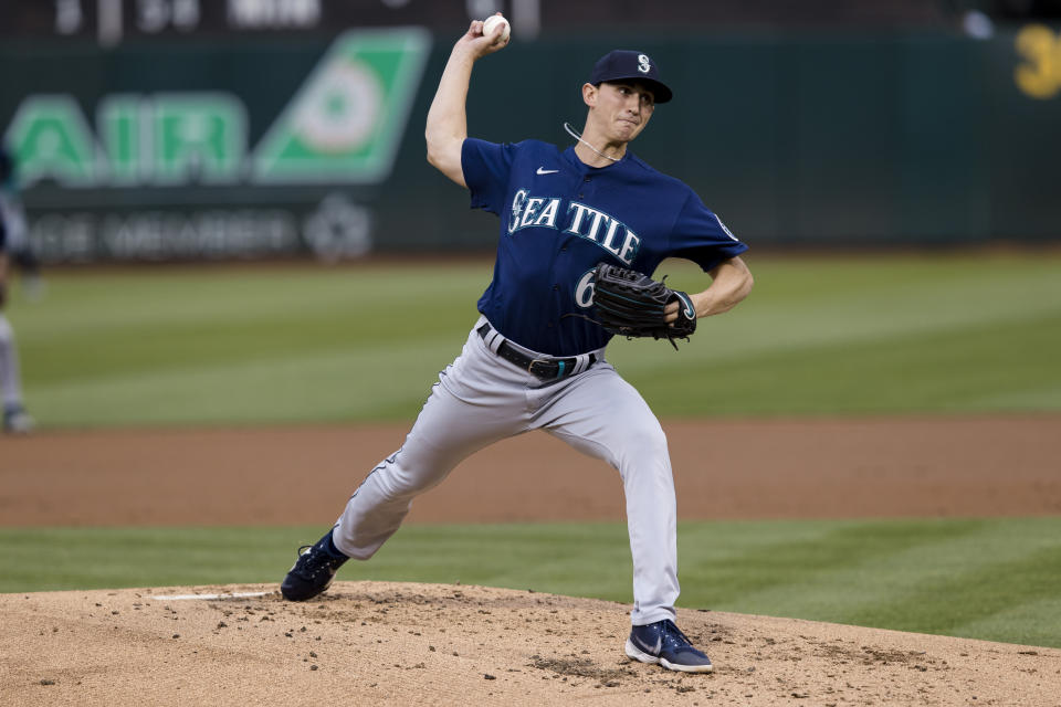 Seattle Mariners' George Kirby pitches against the Oakland Athletics during the first inning of a baseball game in Oakland, Calif., Wednesday, June 22, 2022. (AP Photo/John Hefti)