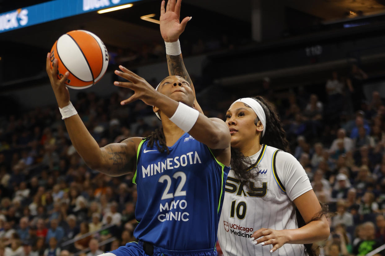 Minnesota Lynx forward Myisha Hines-Allen (22) goes to the basket past Chicago Sky center Kamilla Cardoso (10) in the first quarter of a WNBA basketball game Friday, Sept. 13, 2024, in Minneapolis. (AP Photo/Bruce Kluckhohn)