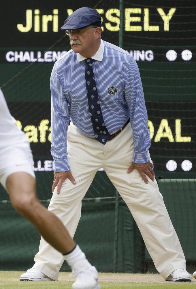 A Wimbledon linesman may or may not have provided the inspiration for Meghan Markle’s court-side look.