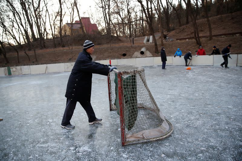 The Wider Image: On a frozen pond far from the Olympics, meet China's ice hockey veterans