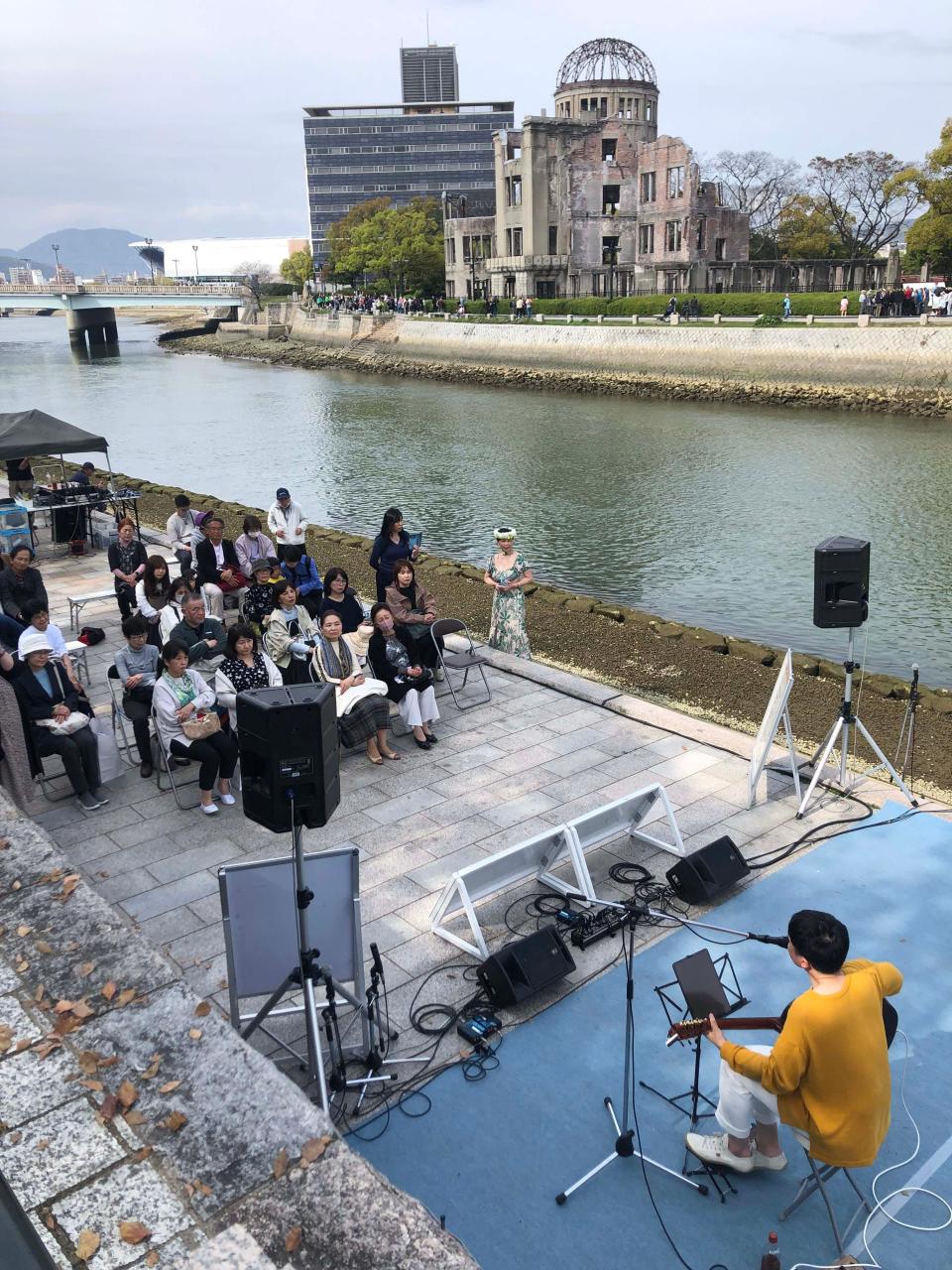 An audience listens to a soft rock concert in Hiroshima Peace Park in Hiroshima, Japan. The park is a commemmoration of the atomic bomb that the United States dropped in August 1945 that brought an end to World War II.