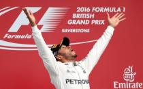 Britain Formula One - F1 - British Grand Prix 2016 - Silverstone, England - 10/7/16 Mercedes' Lewis Hamilton celebrates on the podium after winning the race REUTERS/Matthew Childs Livepic EDITORIAL USE ONLY.