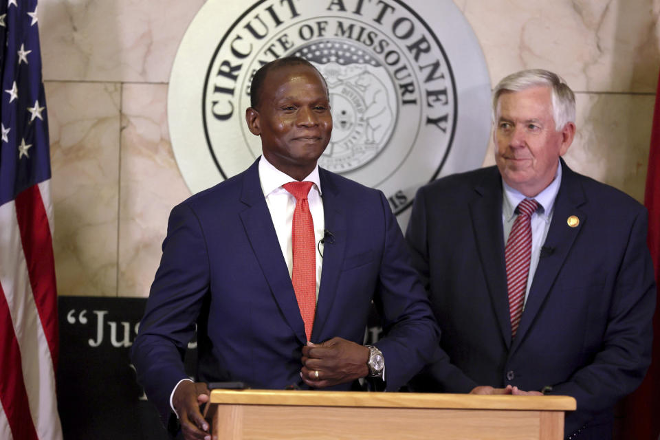 Gabe Gore steps to the podium after Gov. Mike Parson, right, announced that he would be the new St. Louis Circuit Attorney, replacing Kimberly M. Gardner, during a press conference on Friday, May 19, 2023 at the Carnahan Courthouse in St. Louis. (David Carson/St. Louis Post-Dispatch via AP)