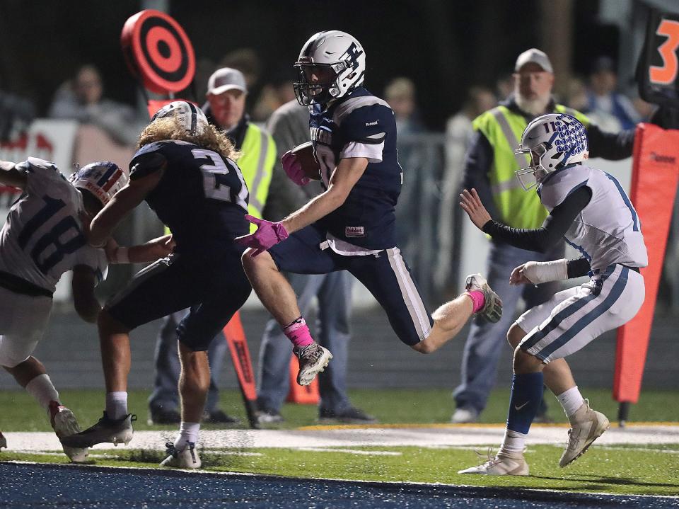 Fairless' Hunter Campbell runs for one of his four touchdowns in a 47-12 win against Tuslaw at Fairless on Oct. 22, 2021.