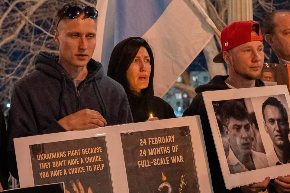 Demonstrators hold signs marking the second anniversary of Russia’s invasion of Ukraine during a candlelight vigil near the Tower Bridge in Sacramento on to mourn the loss of Alexei Navalny, the Russian opposition leader who died in an Arctic penal colony earlier this month. Renée C. Byer/rbyer@sacbee.com