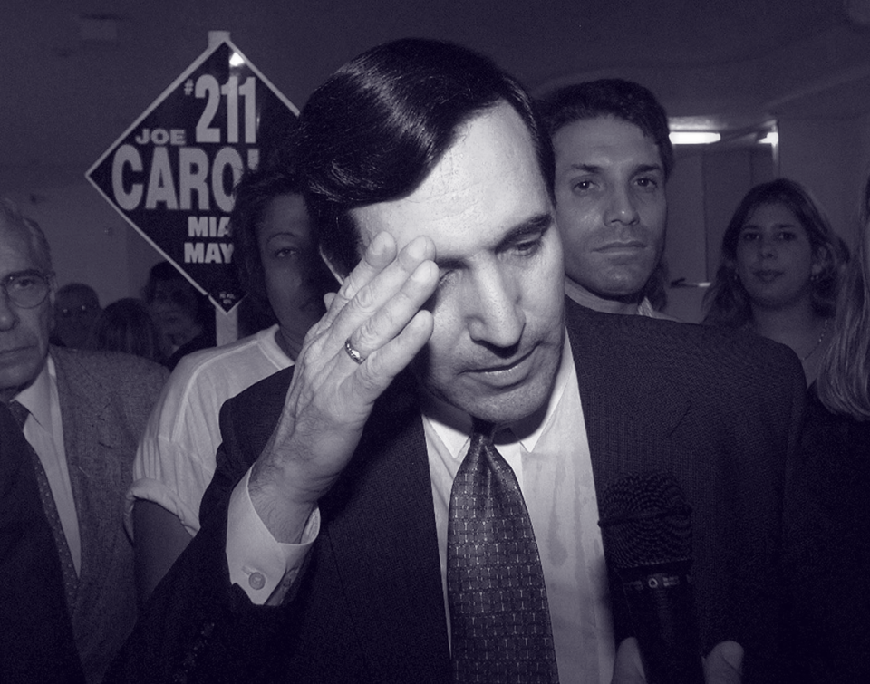 After losing a November 1997 runoff to Xavier Suarez, father of the current mayor, Joe Carollo speaks to reporters while surrounded by somber supporters at his campaign headquarters. David Bergman/Herald Staff