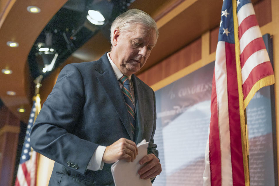 Sen. Lindsey Graham, R-S.C., walks off after speaking to reporters during a news conference at the Capitol, Thursday, Jan. 7, 2021, in Washington. Graham said Thursday that the president must accept his own role in the violence that occurred at the U.S. Capitol. (AP Photo/Manuel Balce Ceneta)