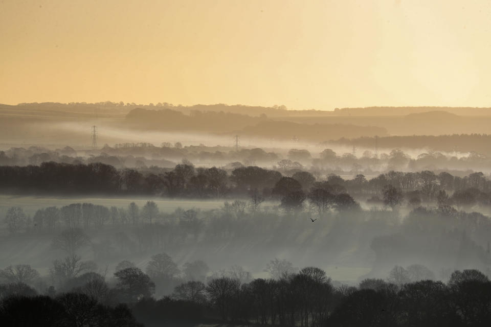 Early morning mist over fields near Pewsey in Wiltshire as plunging temperatures are expected across the country this weekend with the mercury predicted to dip as low as -6C.