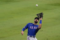 Texas Rangers right fielder Joey Gallo catches a foul ball hit by Los Angeles Angels' Mike Trout during the third inning of a baseball game Friday, Sept. 18, 2020, in Anaheim, Calif. (AP Photo/Ashley Landis)