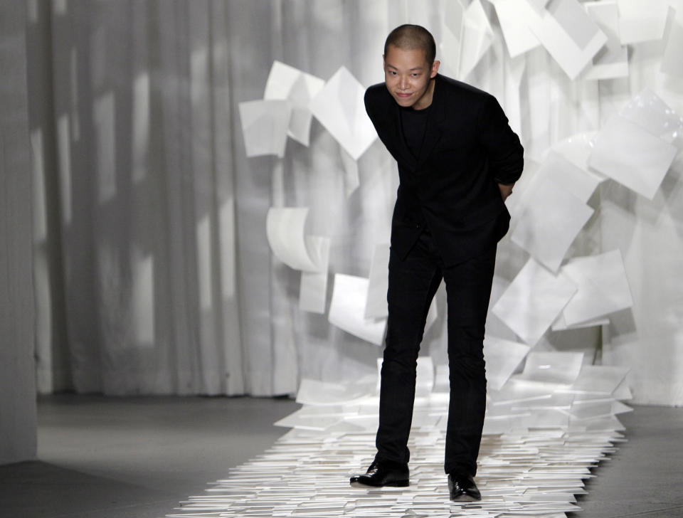 FILE - In this Sept. 9, 2011 file photo, designer Jason Wu takes a bow after presenting his Spring 2012 collection during Fashion Week in New York. Wu may have won international recognition for twice designing inaugural gowns for U.S. first lady Michelle Obama, but judges in his native Taiwan seem unimpressed. Taiwan's Intellectual Property Court ruled Monday, Jan. 21, 2013 that Wu's new label "Miss Wu" could not be registered as a brand because it was not distinctive enough. He designed Michelle Obama's white inaugural gown in 2008. On Monday, she appeared in another of his creations, a shiny gown with a red halter top. (AP Photo/Mary Altaffer, File)