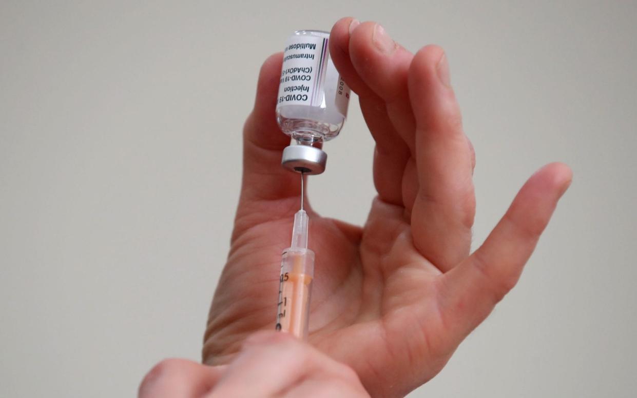 A healthcare worker fills a syringe with a dose of the Oxford/AstraZeneca coronavirus vaccine at the Lady Forester Community nursing home in Wenlock, Shropshire. PA Photo. Picture date: Wednesday January 13, 2021. Health Secretary Matt Hancock told Monday evening's Downing Street press conference that almost a quarter of care home residents in the UK had received a jab. See PA story HEALTH Coronavirus. Photo credit should read: Nick Potts/PA Wire - Nick Potts/PA Wire