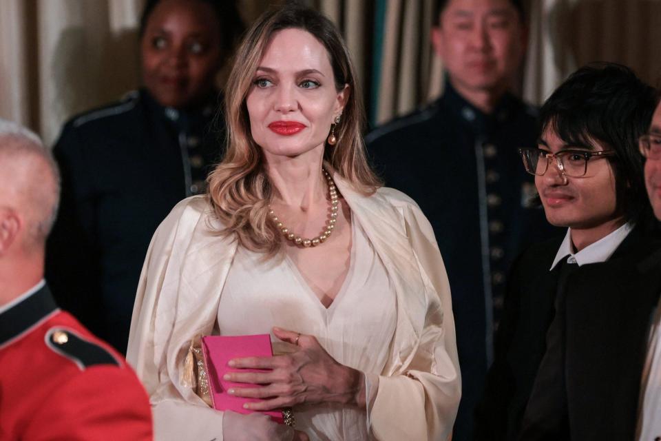 Proud mom Angelina Jolie attends White House soirée with son Maddox