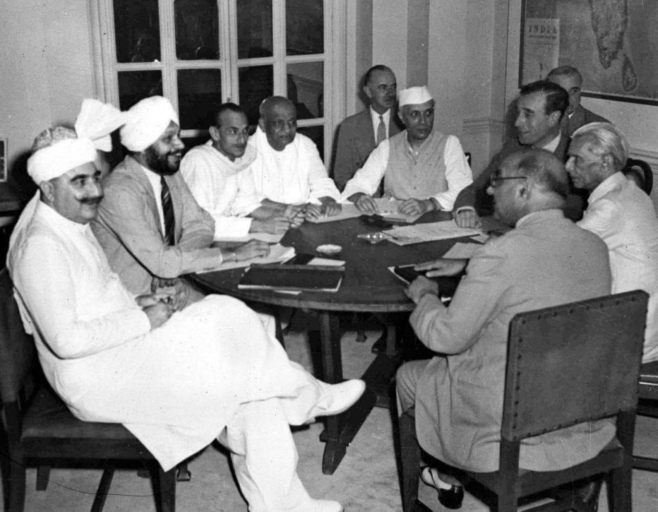 India Round Table Conference: Lord Louis Mountbatten, Viceroy of India, met with seven Indian leaders in the study of the Viceregal Lodge, New Dlhi, India, June 2, 1947, to discuss the British Government’s plan for the Seperation of India. Seated left to right clockwise around the table; Sardar Abdur Rab Nishtar, Communications Member of the Interim Government (also representing the Muslim League);Sardar Baldev Singh, War Member (representing Sikhs); Achatya Kripalani, President of the All India Congress Party; Sardar Patel, Home, Information and Broadcast Member (for Congress); Pandit Jawarharlal Nehru, Vice President of the Interim Government; Lord Louis Mountbatten; Muhammad Ali Jinnah, President of the Muslim League; Liaquat Ali Khan, Finance Member (also for Muslim League). (AP Photo)