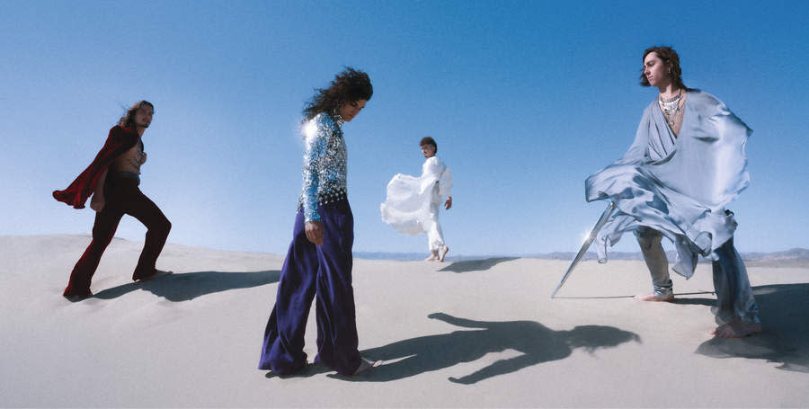 Greta Van Fleet larking about on some salt flats