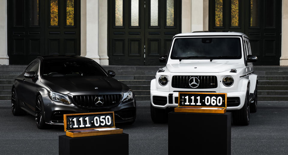 Two Mercedes cars with Victorian black heritage number plates. 