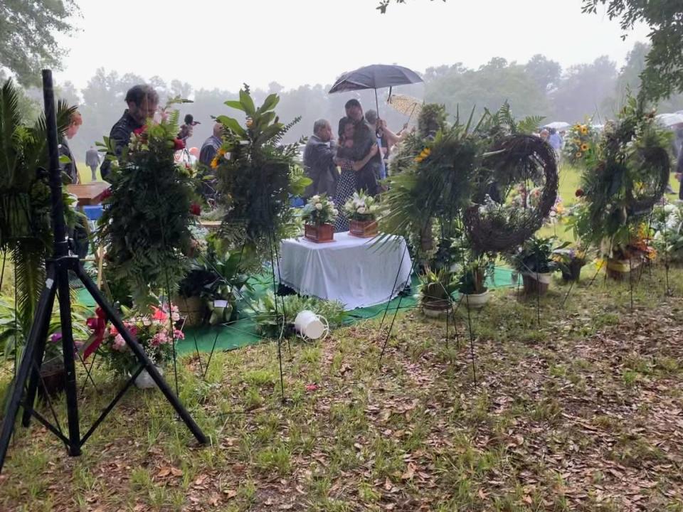 A rainstorm swiftly conclude the funeral services for Paul Murdaugh and his mother Maggie on June 11, 2021. Some attendees stayed back to pay respects at the graveside.