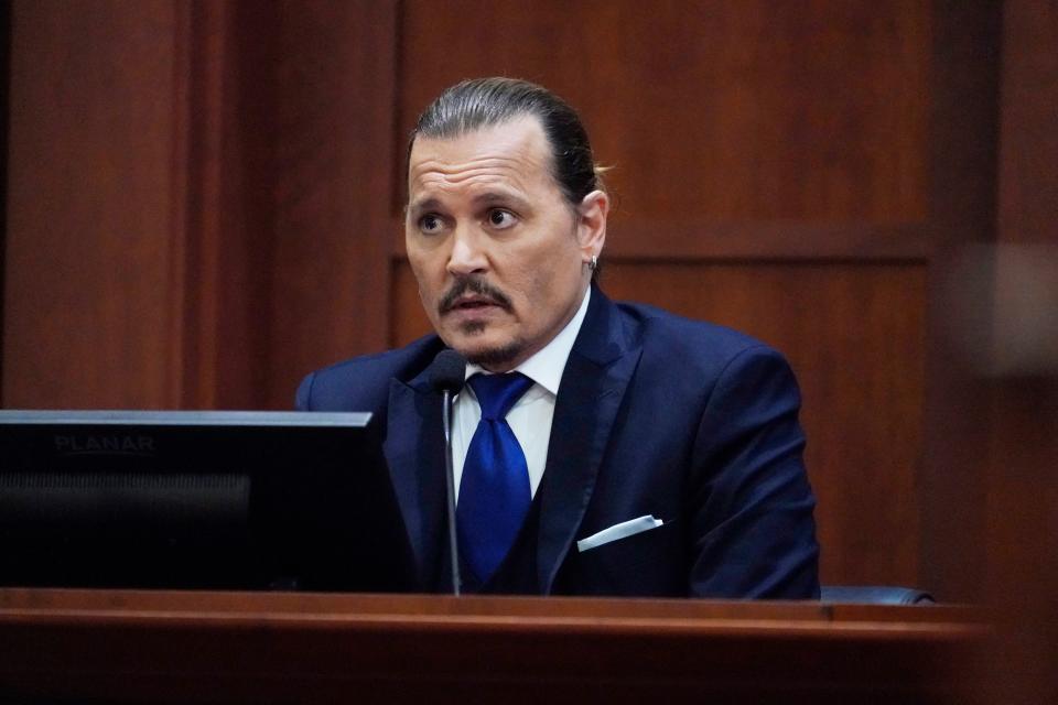 Johnny Depp testifies in the courtroom at the Fairfax County Circuit Courthouse in Fairfax, Virginia, April 25, 2022