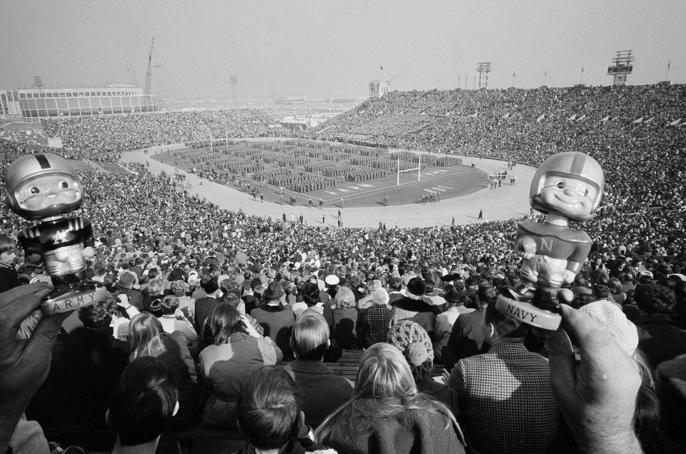 In this Nov. 29, 1969, file photo, with Army cadets on the field and midshipmen in the stands, nearly 100,000 persons wait for the kickoff of the 70th annual Army Navy game in Philadelphia's John F. Kennedy Memorial Stadium. The 118th Army Navy game takes place in Philadelphia on Dec. 9, 2017.