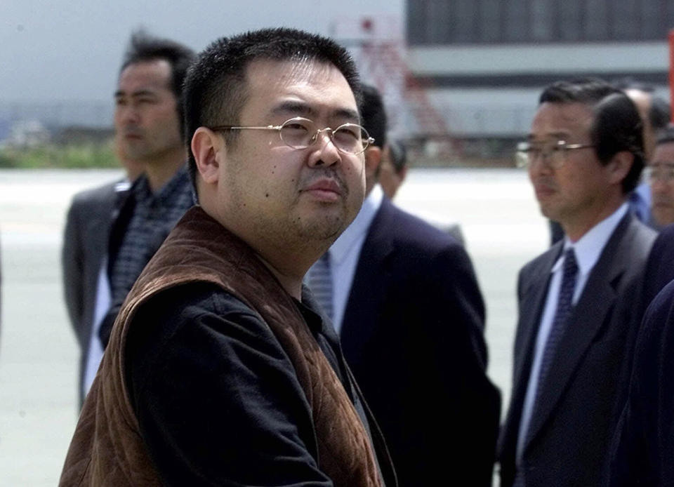 FILE - In this May 4, 2001 file photo, Kim Jong Nam, the eldest son of North Korean leader Kim Jong Il, prepares to board a plane to Beijing at Narita international airport near Tokyo, Japan. Kim was fatally poisoned at Kuala Lumpur's airport on Feb. 13, 2017, in one of the most brazen instances of assassination in recent memory in an attack that authorities said used VX nerve agent. Strong suspicion has fallen on North Korean agents. (AP Photo/Shizuo Kambayashi, File)