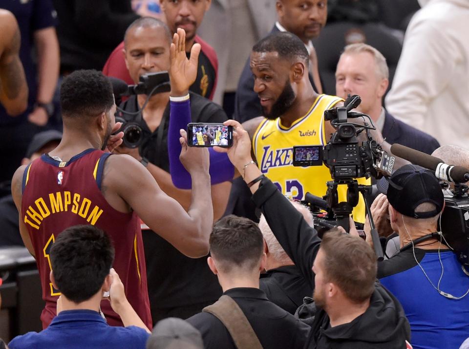 LeBron James greets former Cavaliers teammate Tristan Thompson after returning to Cleveland for the first time as a member of the Lakers on Nov. 21, 2018.