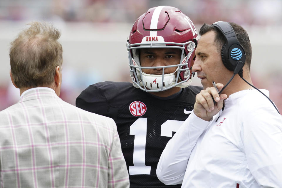 Alabama Crimson Tide quarterback Tua Tagovailoa (13) talks with Alabama Crimson Tide head coach Nick Saban and offensive coordinator Steve Sarkisian at Bryant-Denny Stadium. (Credit: USAT)