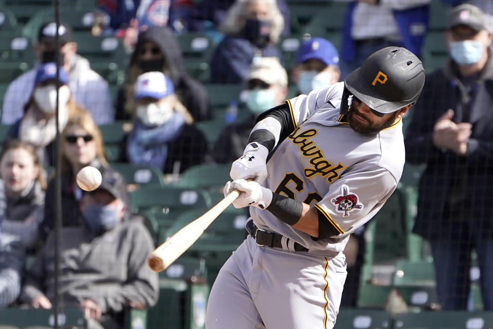 Pittsburgh Pirates' Ka'ai Tom hits an RBI-single during the ninth inning of a baseball game against the Chicago Cubs, Friday, May 7, 2021, in Chicago. (AP Photo/Charles Rex Arbogast)