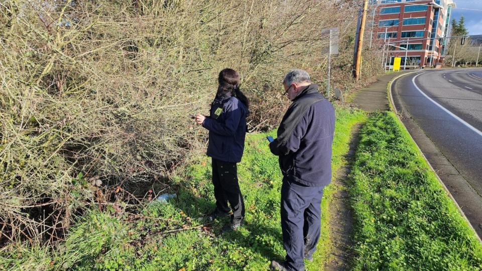 PHOTO: NTSB investigators search the area where a mobile phone of a passenger was found, after an Alaska Airlines Flight 1282 Boeing 737 MAX 9 jet lost a panel mid-flight last week, in Beaverton, Ore., Jan. 7, 2024. (Sean Bates via Reuters)