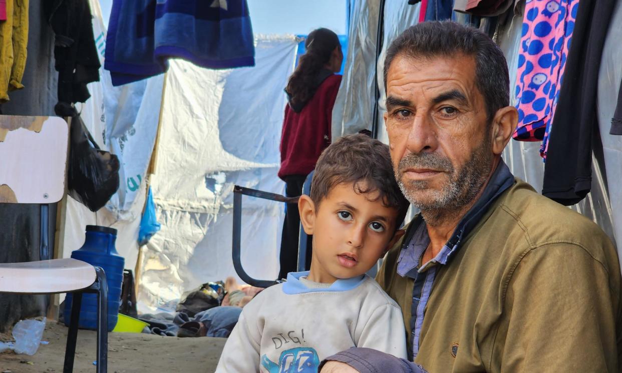 <span>Bashir Alyan, a 52-year-old former employee of the Palestinian Authority, who is now living in a tent in Rafah with his five children.</span><span>Photograph: Enas Tantish</span>