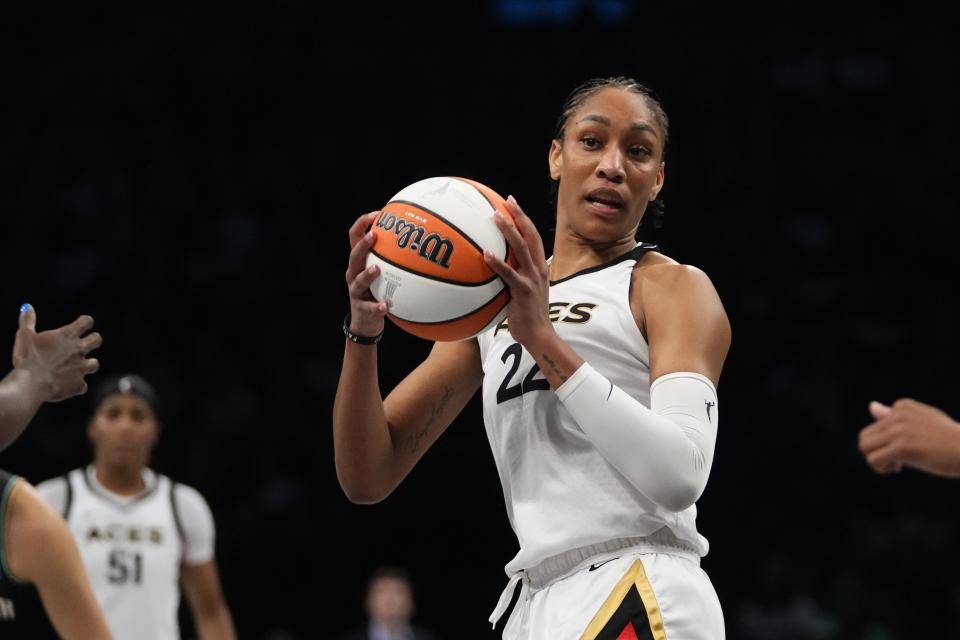 Las Vegas Aces' A'ja Wilson (22) looks to pass during the second half in Game 4 of a WNBA basketball final playoff series against the New York Liberty, Wednesday, Oct. 18, 2023, in New York. The Aces won 70-69. (AP Photo/Frank Franklin II)