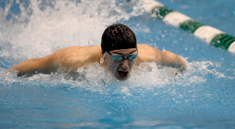Hoover’s Peter Helmuth competes in the boys 100-yard butterfly in the Division I district meet at Cleveland State, Saturday, Feb. 17, 2024.