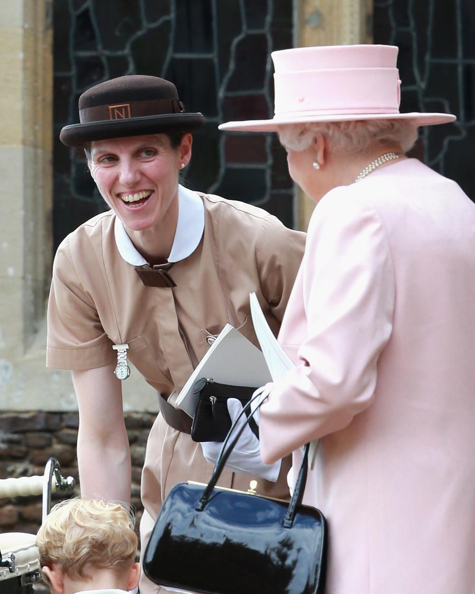 KING&#39;S LYNN, ENGLAND - JULY 05:  Prince George&#39;s nanny, Maria Teresa Turrion Borrallo (in her Norland Nanny Uniform) talks to Queen Elizabeth II as they leave the Church of St Mary Magdalene on the Sandringham Estate for the Christening of Princess Charlotte of Cambridge on July 5, 2015 in King&#39;s Lynn, England.  (Photo by Chris Jackson/Getty Images)