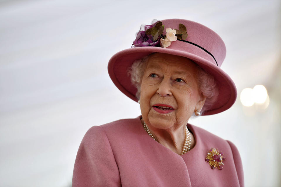 Britain's Queen Elizabeth II visits the Defence Science and Technology Laboratory (DSTL) at Porton Down, England, Thursday Oct. 15, 2020, to view the Energetics Enclosure and display of weaponry and tactics used in counter intelligence. (Ben Stansall/Pool via AP)