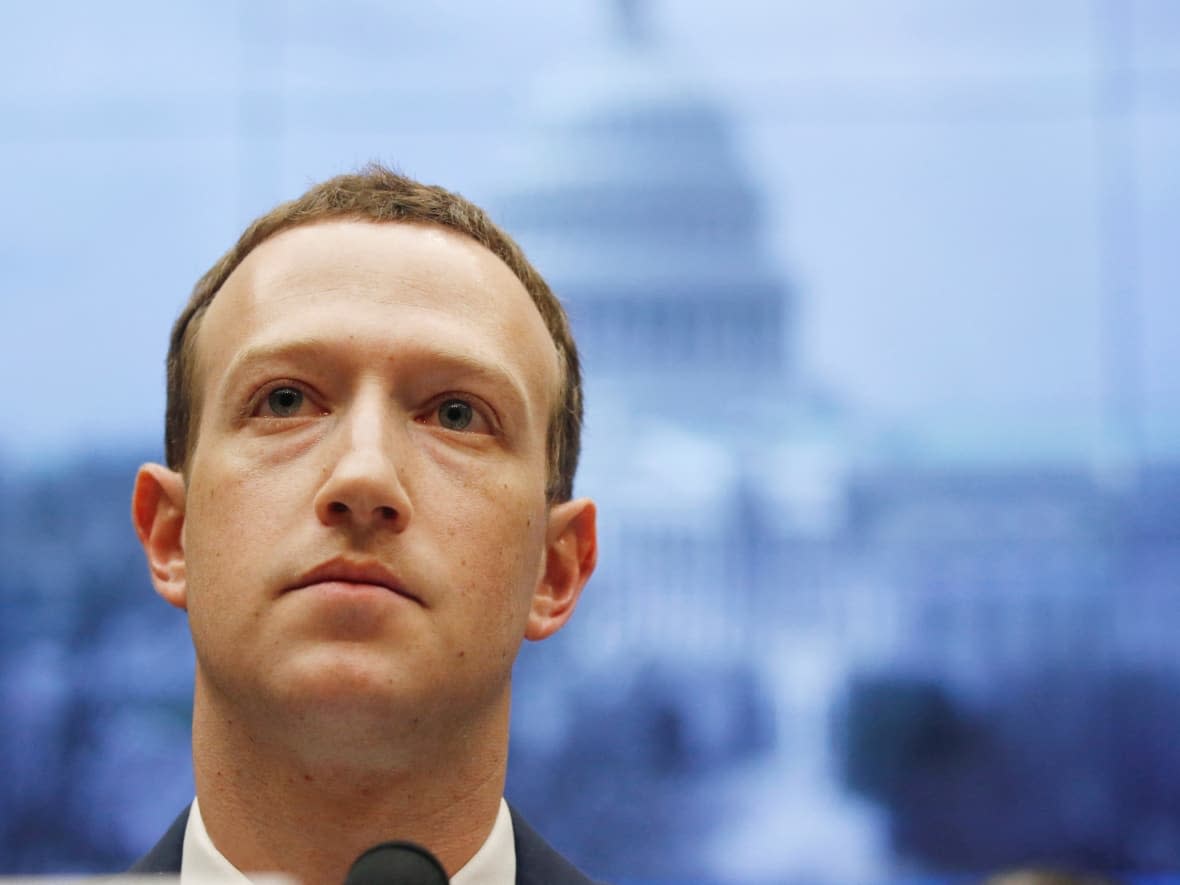 Mark Zuckerberg, head of Facebook parent company Meta Platforms, seen during past testimony before a U.S. congressional committee, has been asked by U.S. Congress to provide details about how many fake Facebook accounts were created by foreign actors to help promote Canada's convoy protests. (Leah Millis/Reuters - image credit)