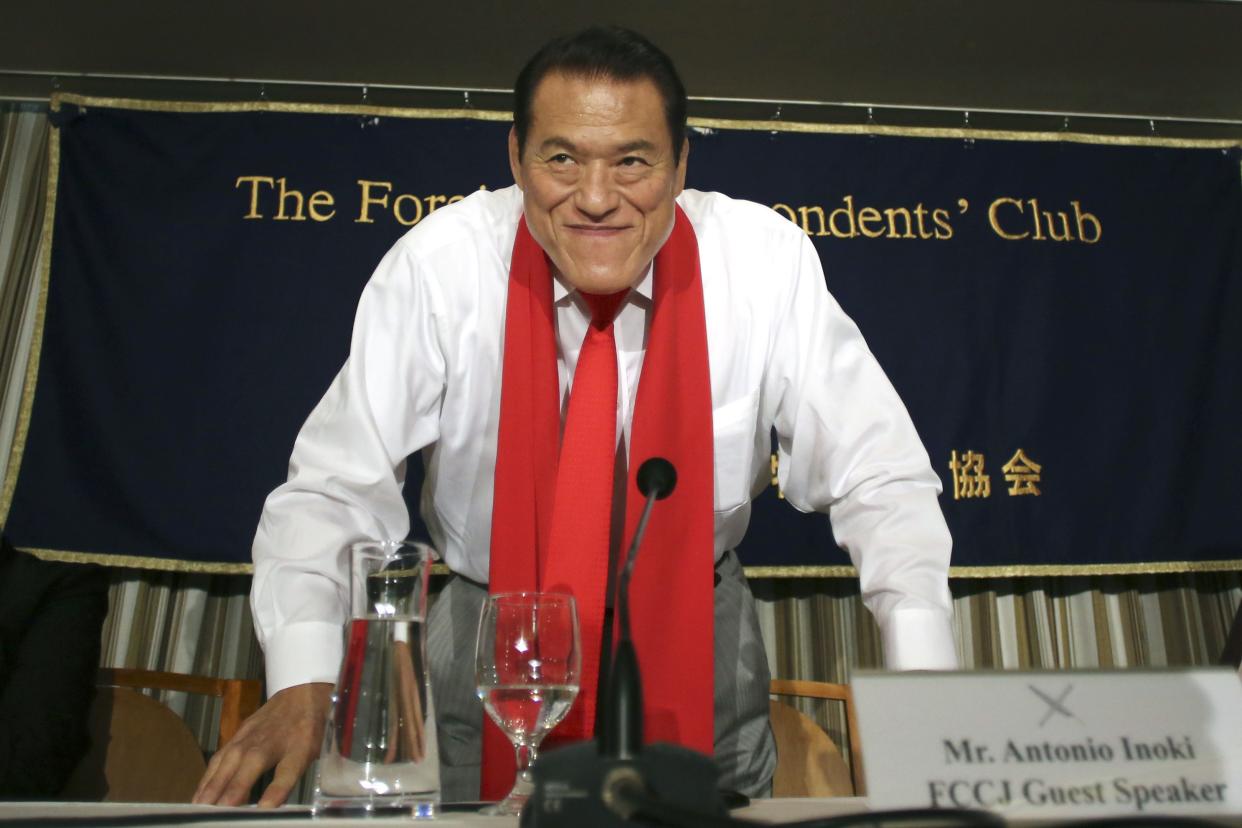 Japanese pro-wrestler-turned-politician Kanji "Antonio" Inoki bows at the end of a news conference at the Foreign Correspondents' Club of Japan in Tokyo on Aug. 21, 2014. 