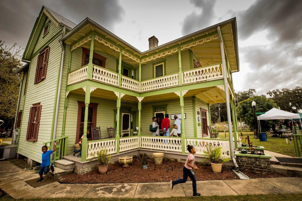 Children scamper around the historic L.B. Brown House in Bartow during the festival in 2019. The 23rd edition of the gathering takes place this weekend.